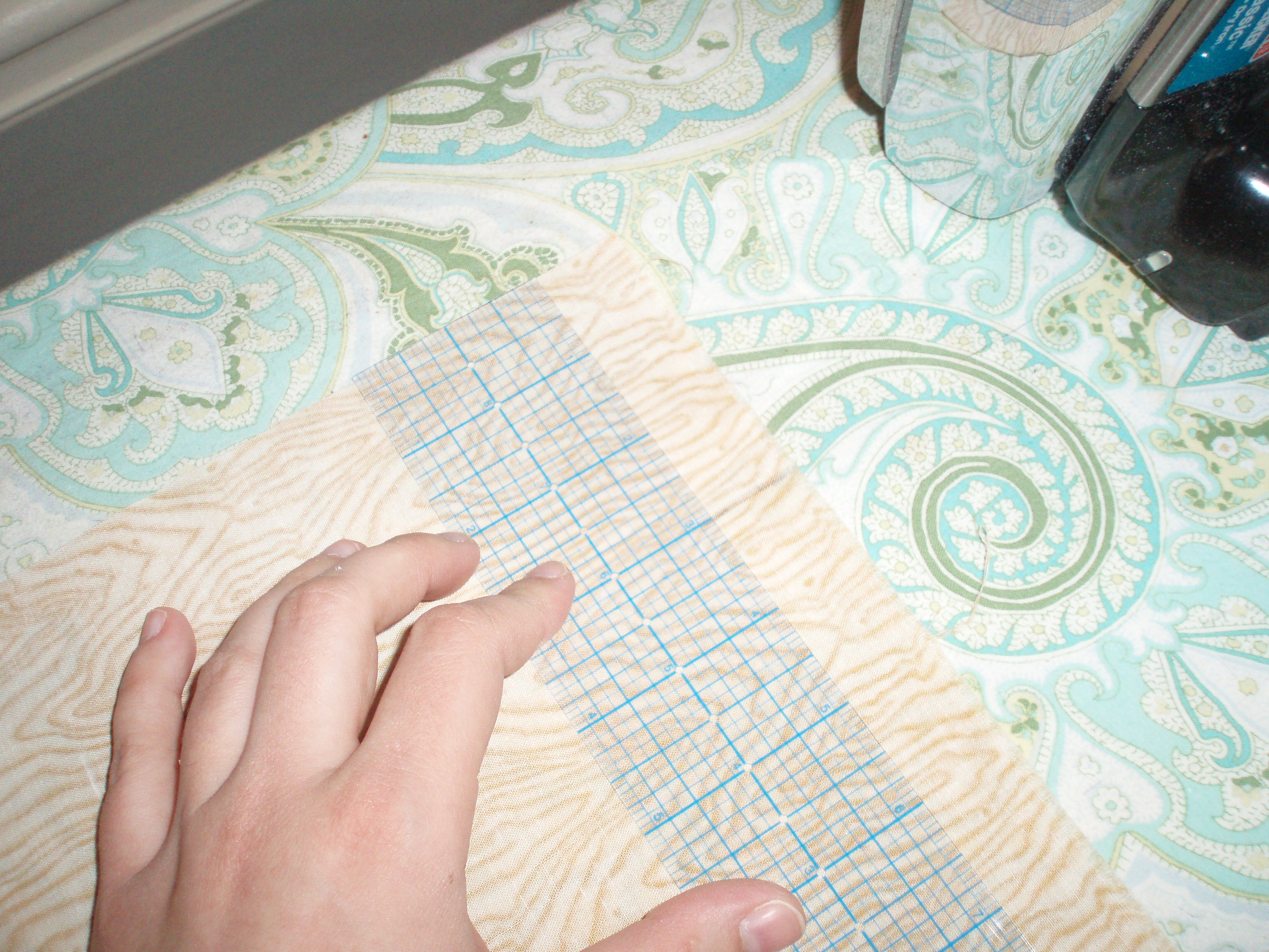 Measuring the edge of fabric using a clear ruler