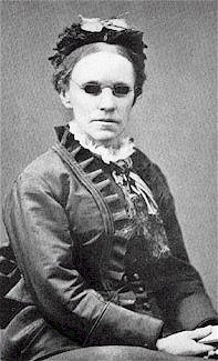 Black and white image of Fanny Crosby wearing small glasses for the blind. 