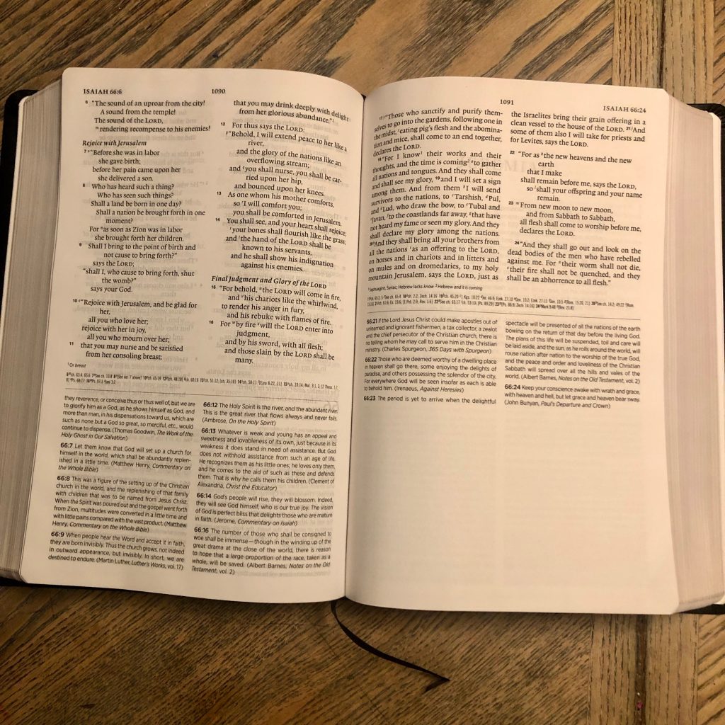Open page view of the Church History Study Bible on wood table. 