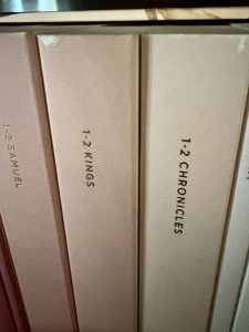 Close up of top edge of books showing wear in the top corner of the book spine. 