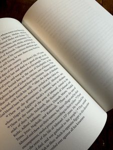 Close up of interior of book showing left side page with Scripture printed and right side lined and blank. 